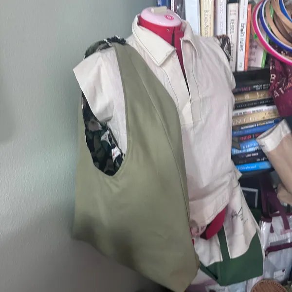 Olive hobo bag on a dress form, made by Jessica Bennett