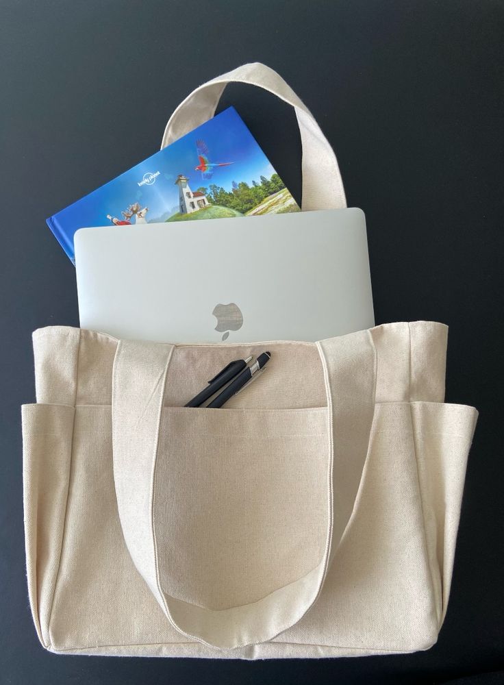Finished natural canvas multi-pocket tote