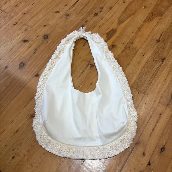 White hobo bag with fringe trim made by Heather Collins