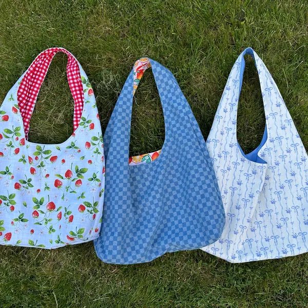Three hobo bags in different fabrics made by Stephanie Harris